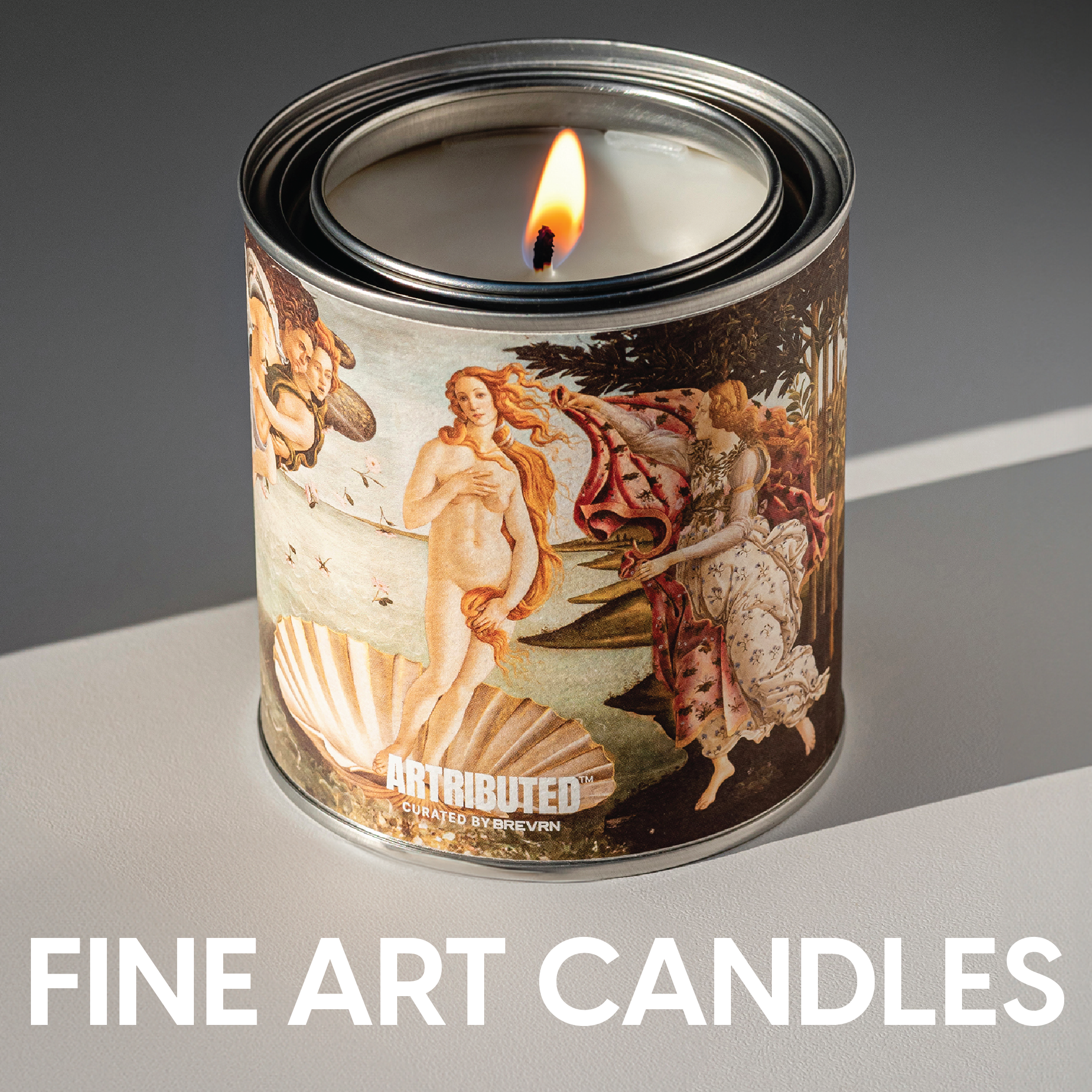 A lit candle featuring the famous artworkThe Birth of Venus by Botticelli and a title that reads Fine Art Candles