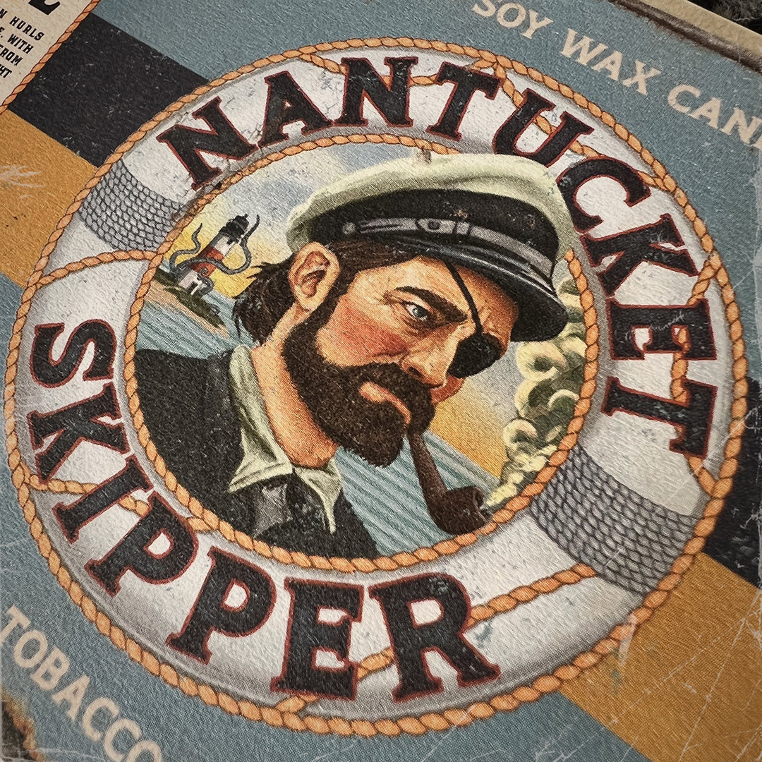 Nantucket Skipper Candle label – vintage maritime-inspired artwork of a rugged sea captain, embodying bold tobacco, mahogany, and cashmere scents