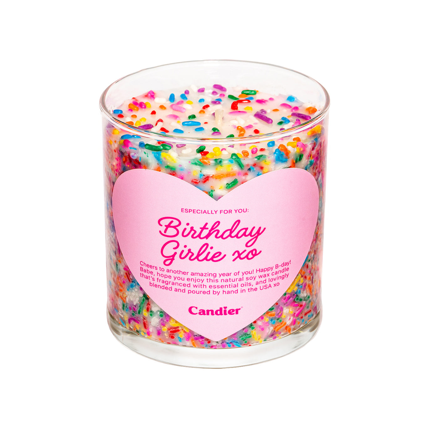 A scented candle decorated with colorful sprinkles and a heart shaped label that reads Birthday Girlie xo Candier