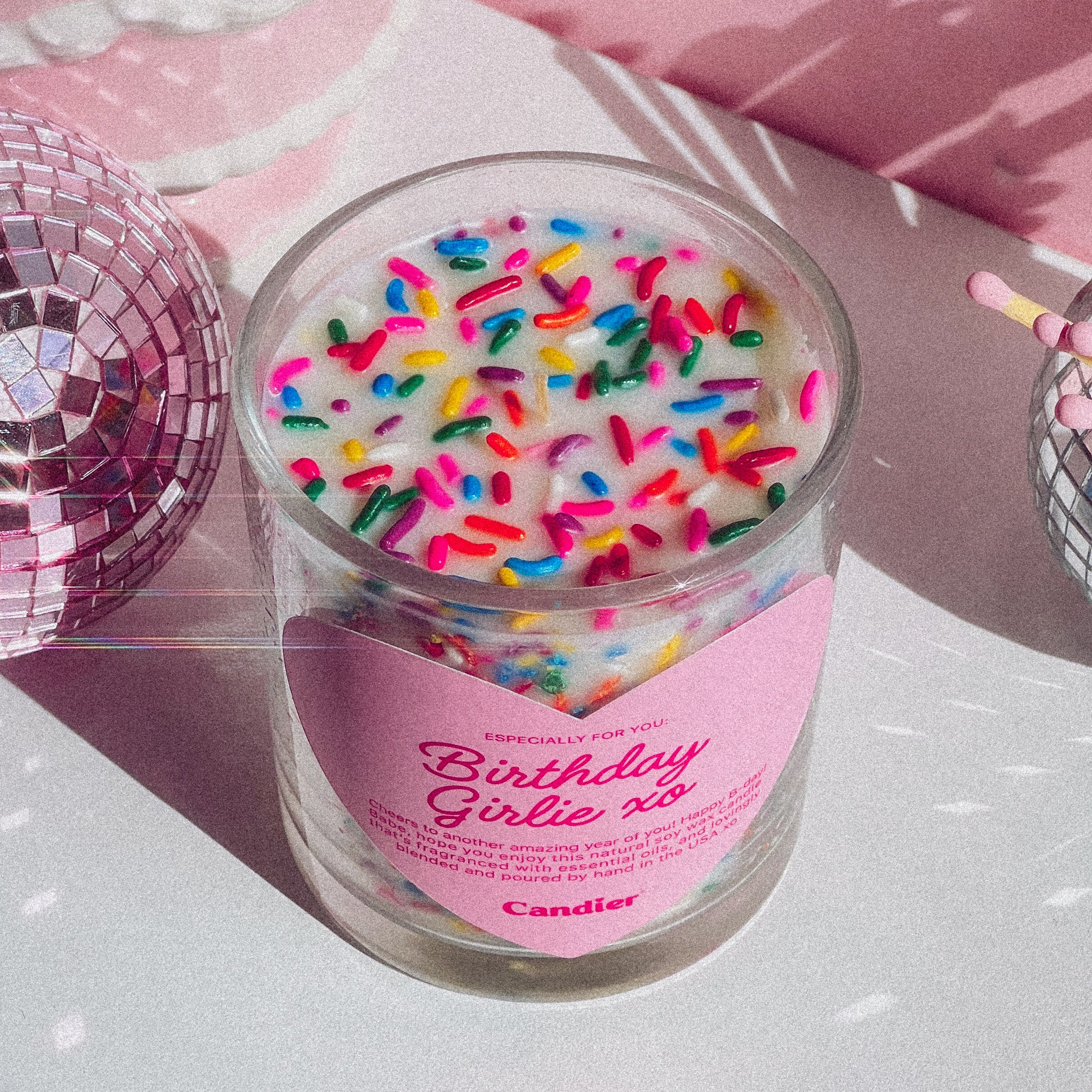 Pink aesthetic birthday candle with sprinkles from Candier®, designed for luxury self-care and fun birthday gifts. A sweet, feminine fragrance with cake, frosting, and soft musk—the ultimate birthday surprise for besties