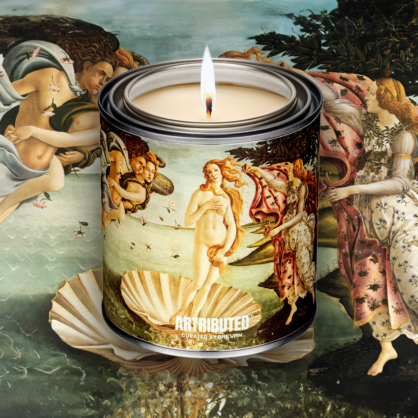 A lit fine art inspired candle depicting Botticelli's Birth of Venus, with the famous artwork filling the background