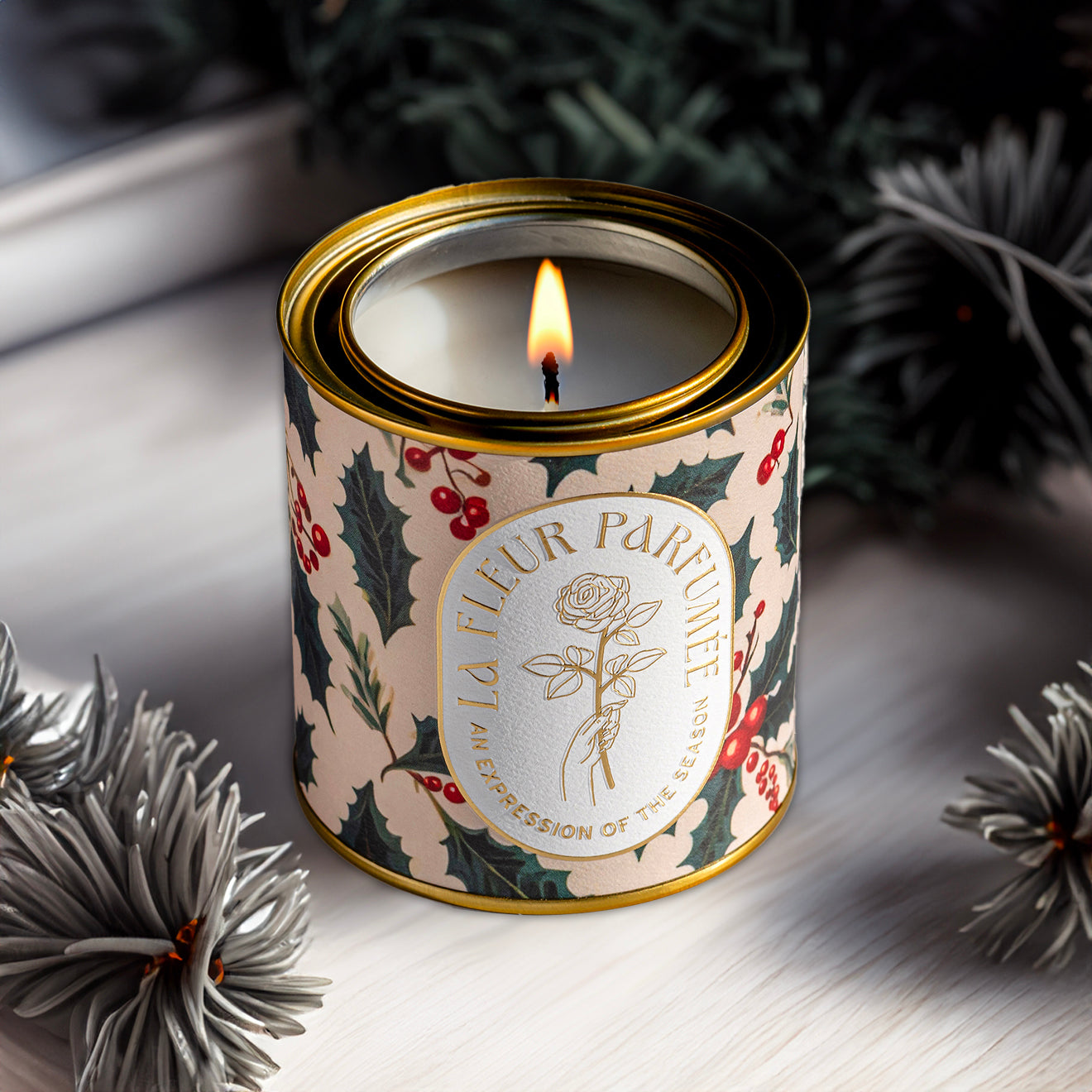 a fancy candle for Christmas with holly and berries 