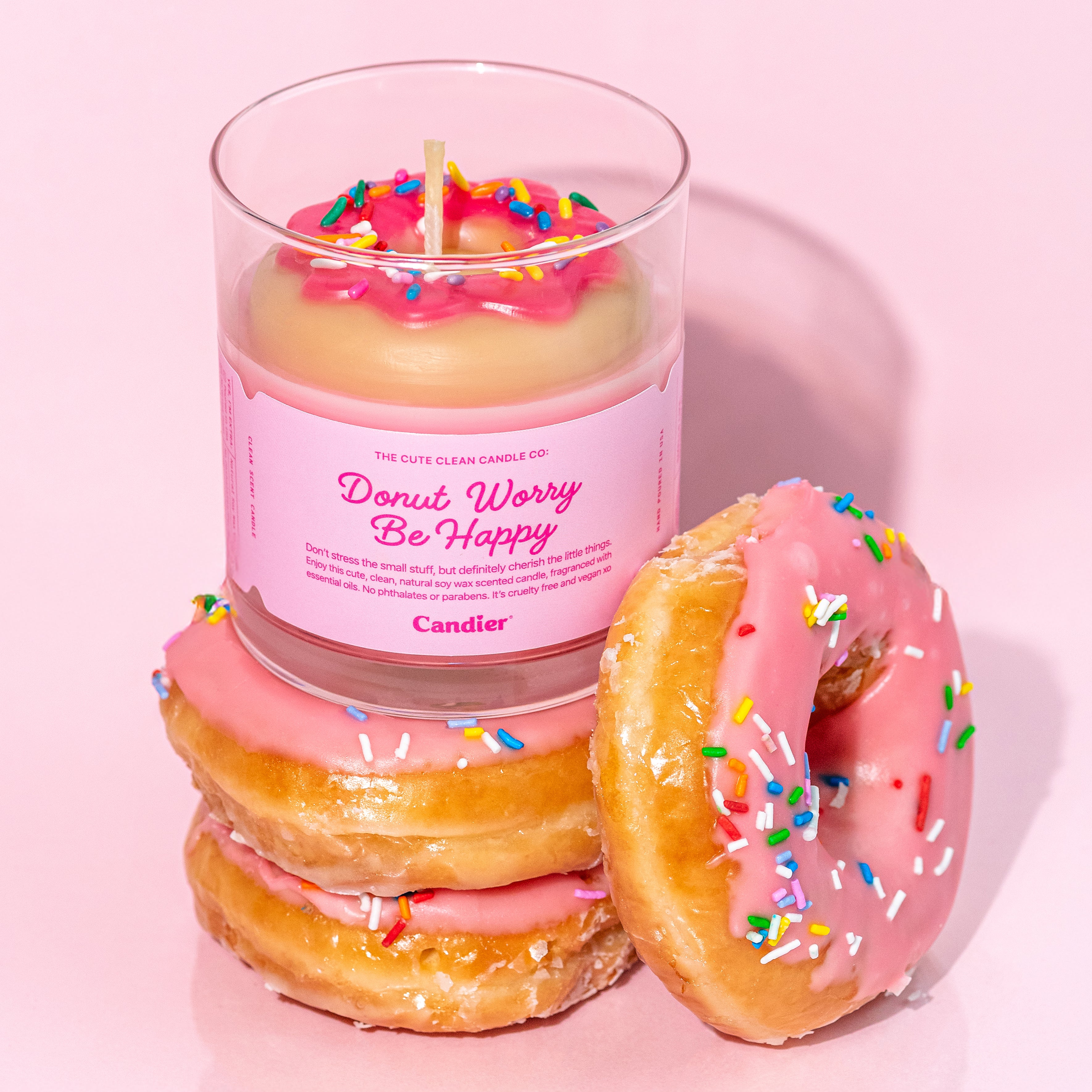 Strawberry donut-scented soy candle by Candier – features a sculpted wax donut with sprinkles, hand-poured in the USA. Luxe and giftable