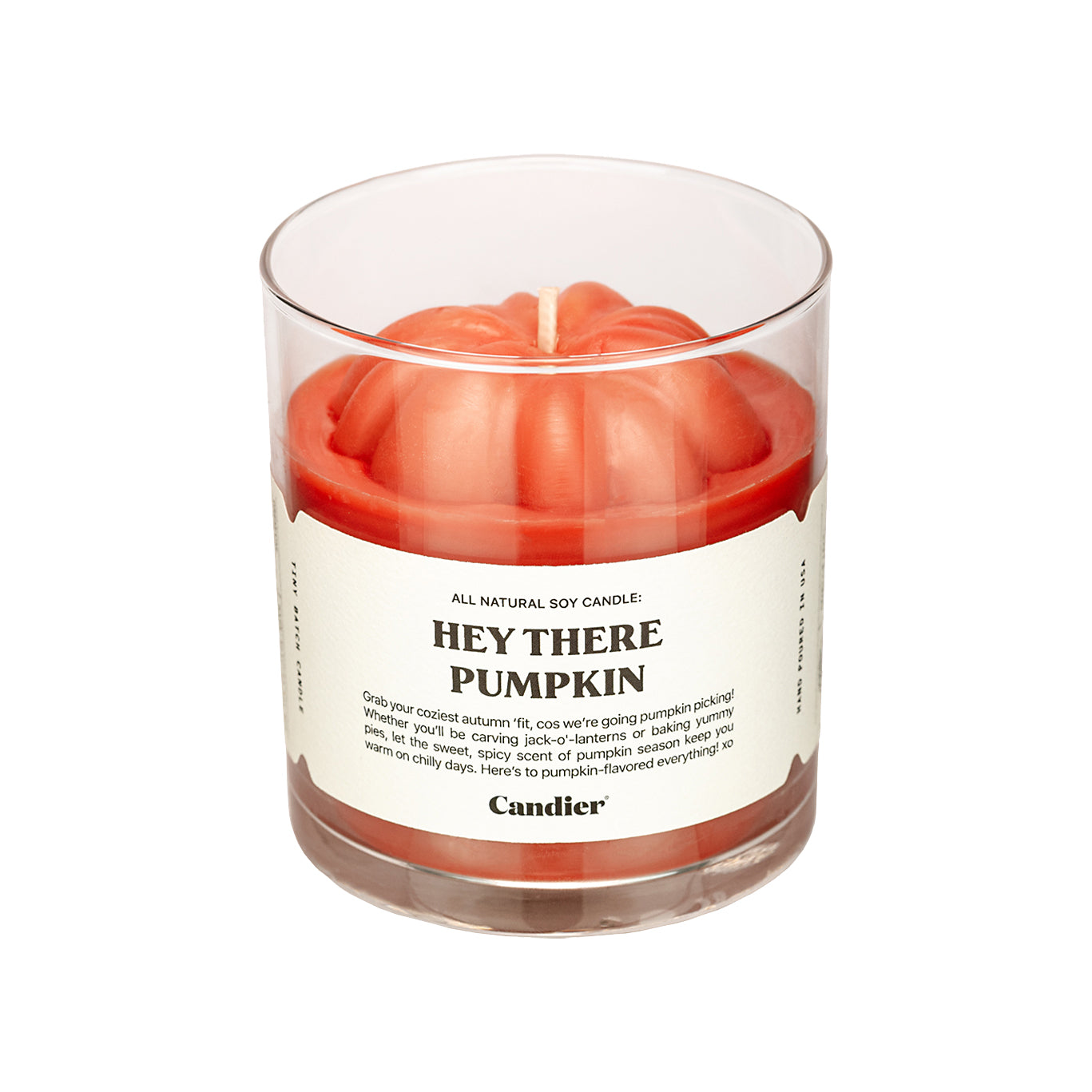 A cute autumn fall candle with a molded wax pumpkin on top and, label that reads Het There Pumpkin