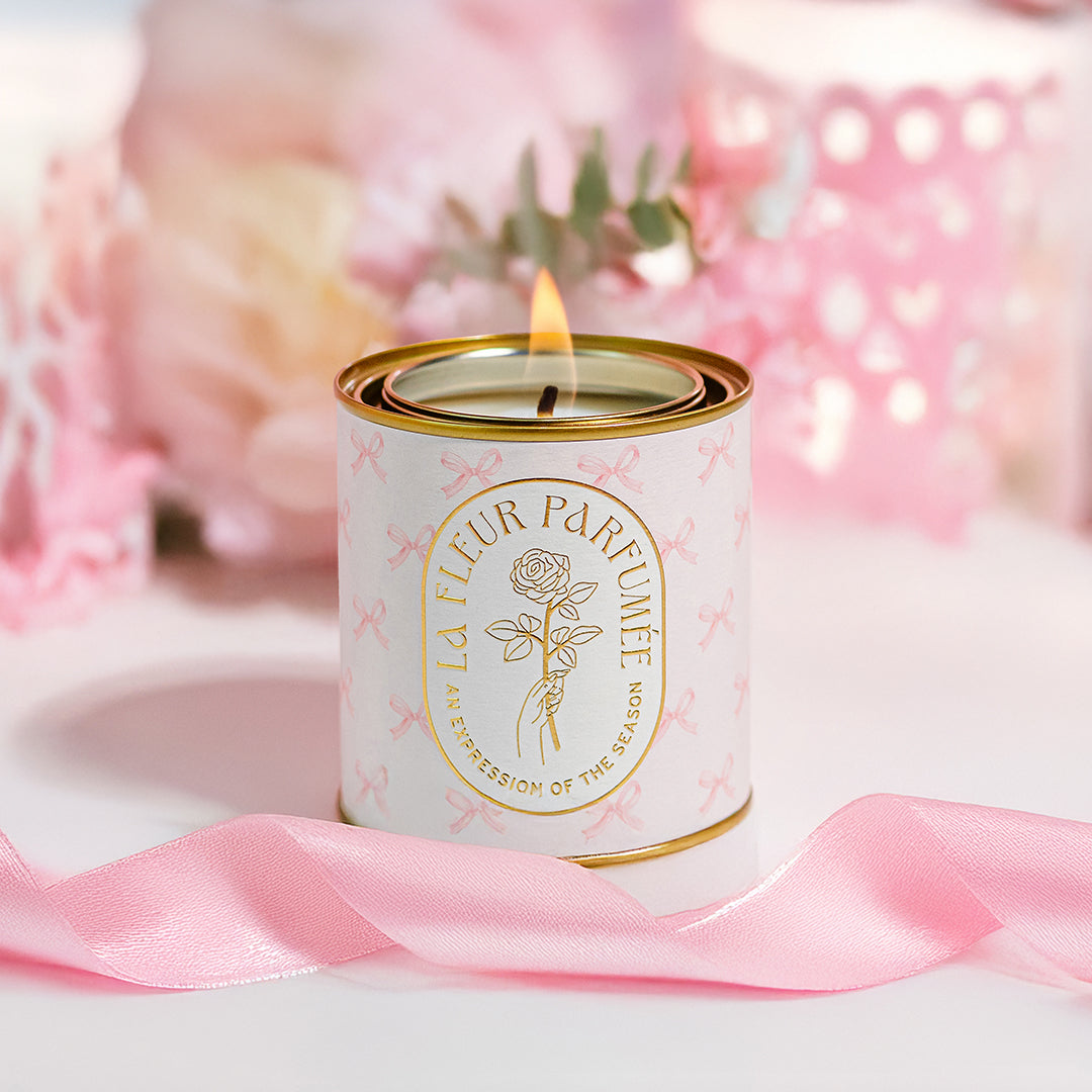 La Fleur Candier's pretty floral-scented candle with coquette bows and a soft girl aesthetic. A romantic and elegant balletcore candle—ideal for birthday gifts for women.