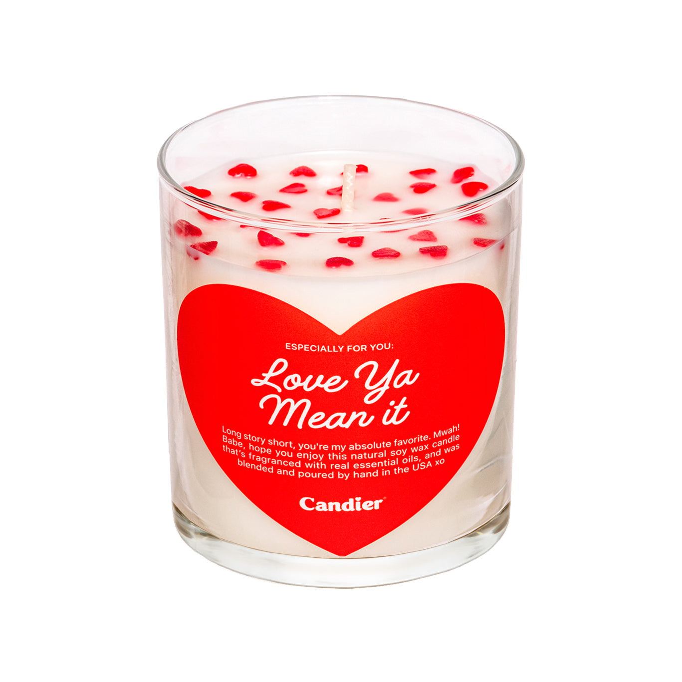 A cute scented candle with heart shaped sprinkles and a heart shaped label that reads Love Ya Mean It by Candier®