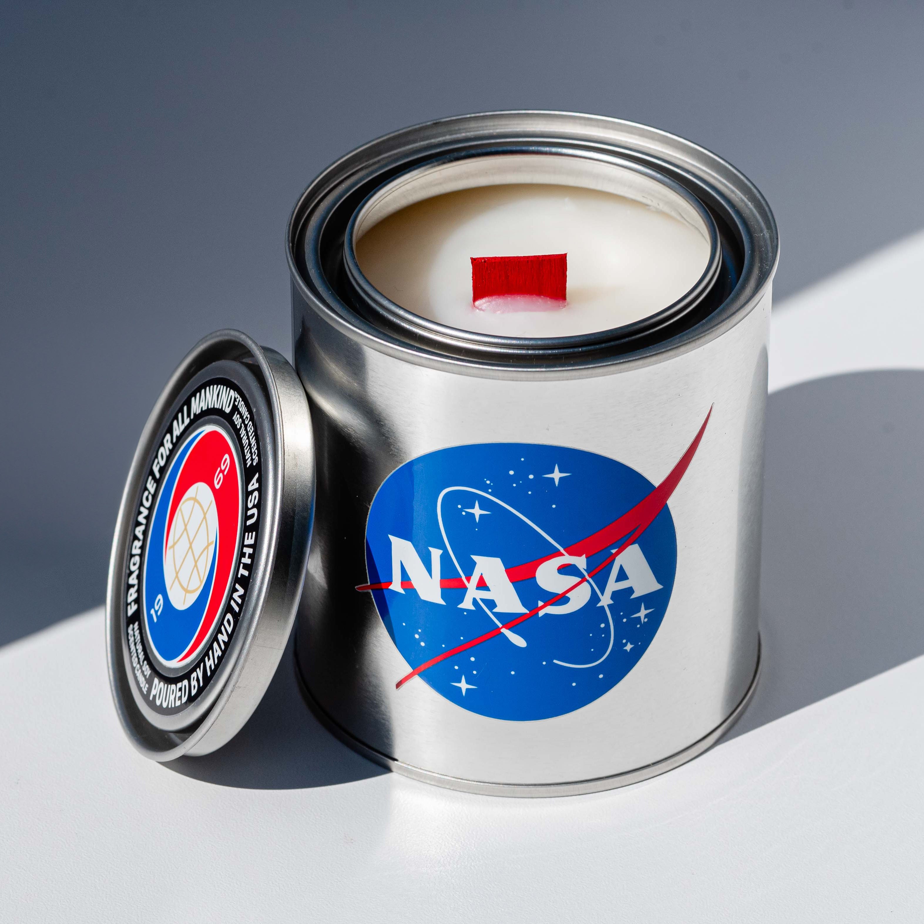 An open BREVRN NASA 1969 candle, highlighting the sleek industrial canister, premium soy wax, and modern fragrance design.