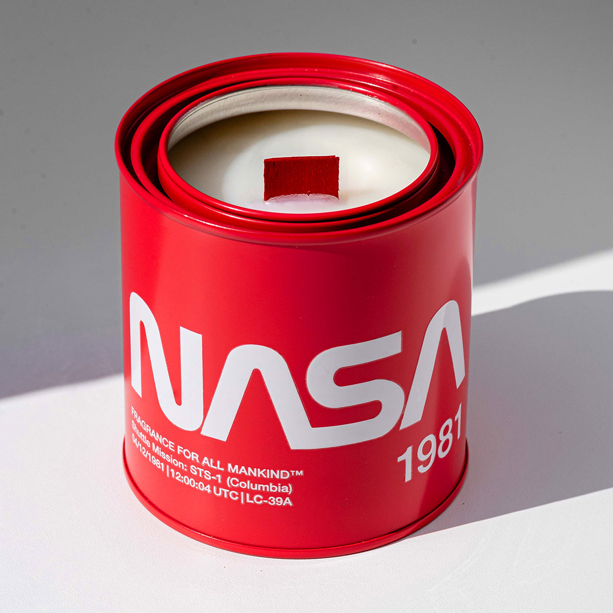 NASA 1981 candle with lid off, showing white wax and chunky wood wick – A sophisticated, masculine home fragrance, featuring patchouli, cedar, and grey amber.