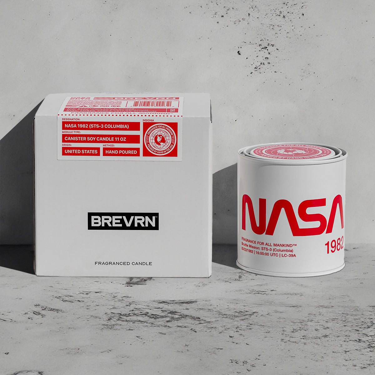 NASA 1982 candle and premium gift packaging displayed together – A luxury home fragrance gift set, hand-poured soy candle, and a NASA-themed collector’s item.