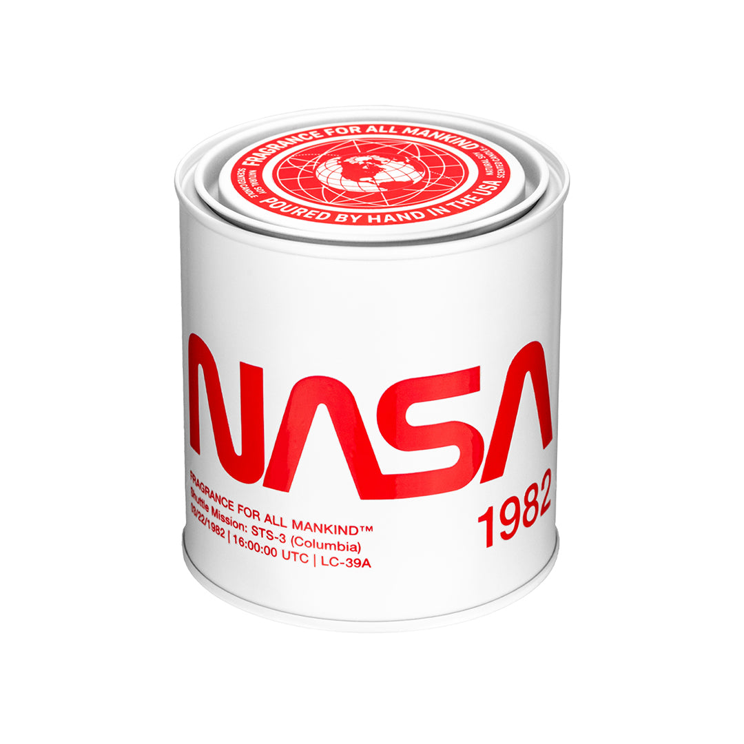 White NASA 1982 candle with bold red NASA logo (AKA NASA Worm logo) in stainless steel canister – A luxury masculine scented candle, inspired by NASA’s 1982 shuttle mission, featuring warm amber, bergamot, and vetiver.