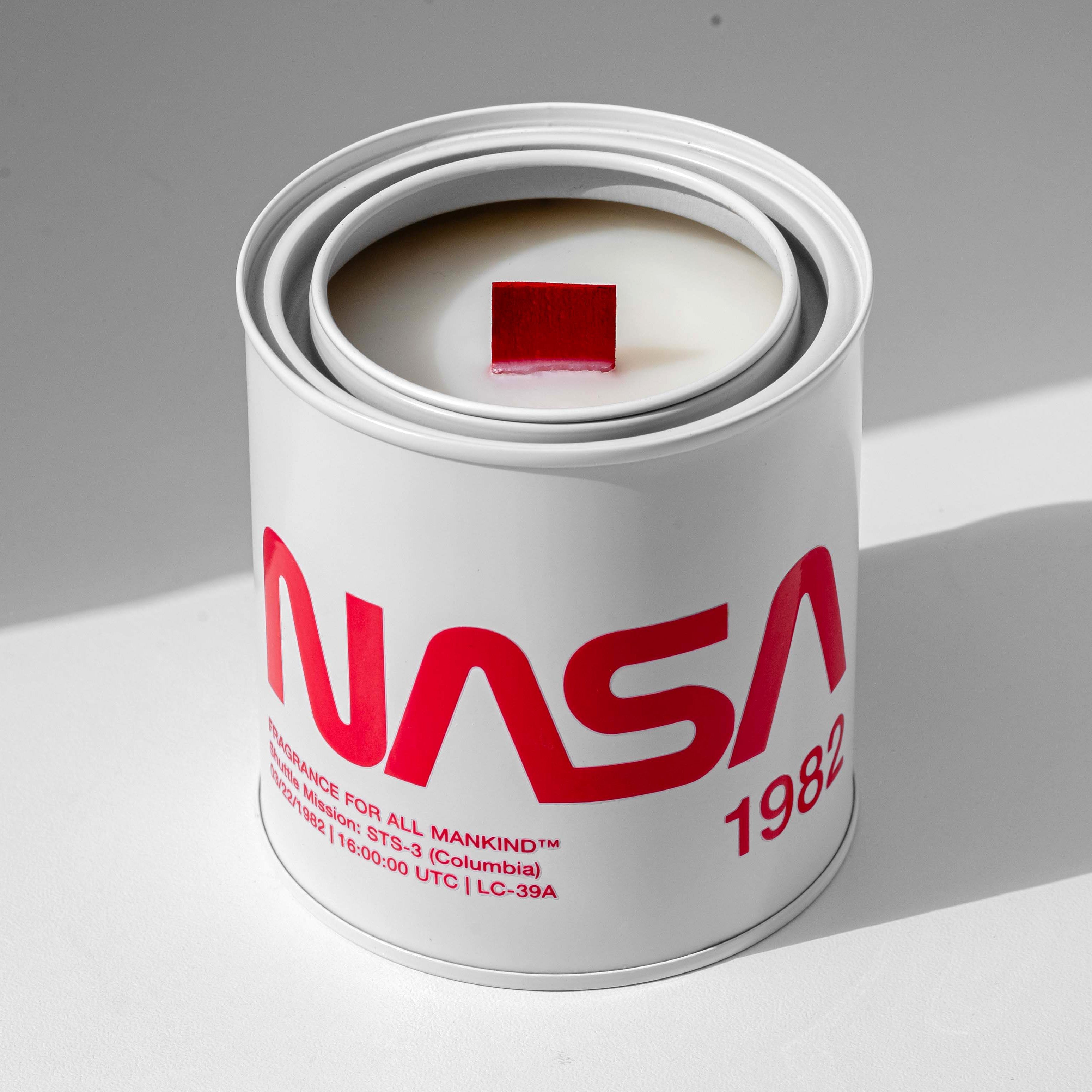 NASA 1982 candle with lid off, revealing premium red wood wick and soy wax – Hand-poured in the USA, this high-end candle delivers a bold, complex fragrance for science lovers and collectors.