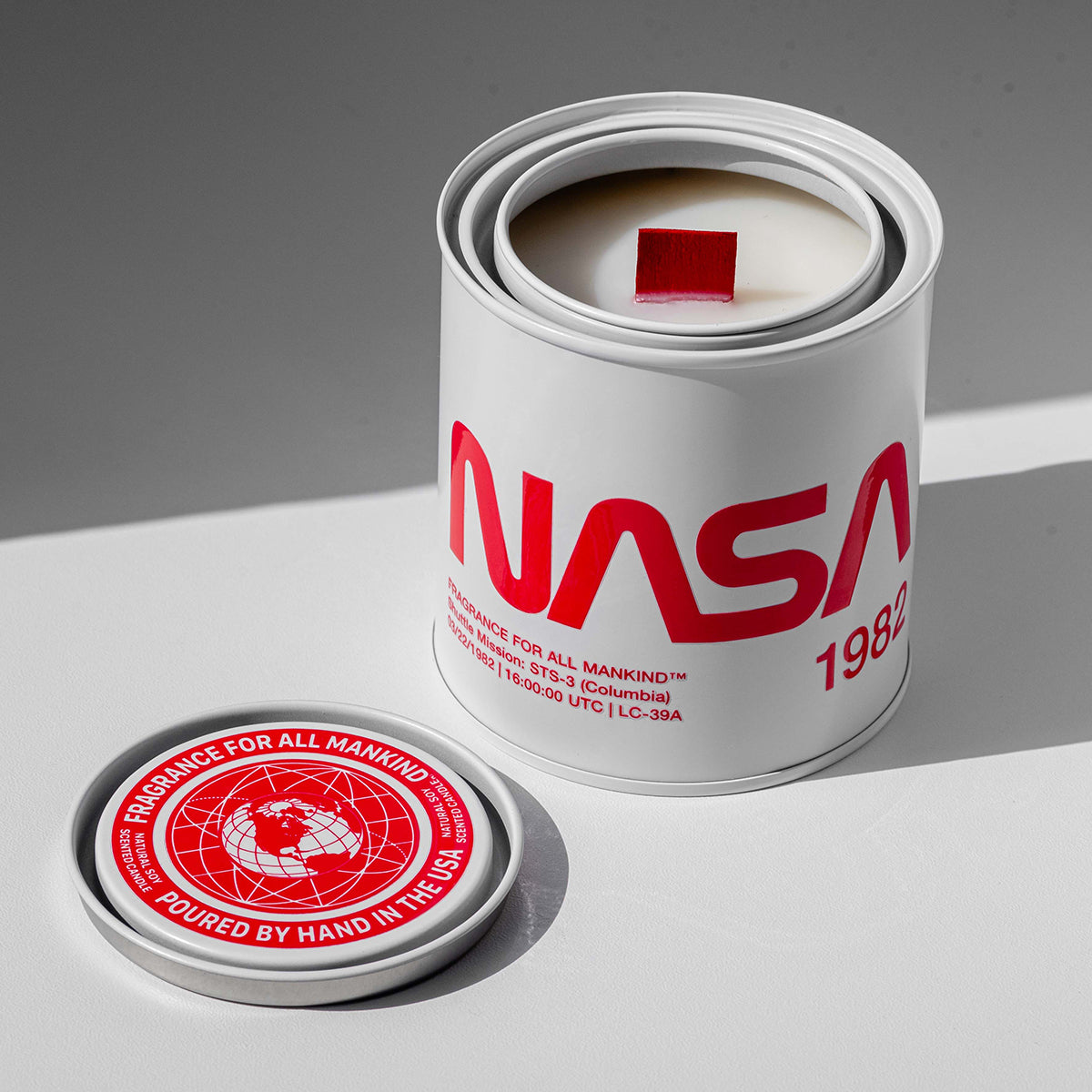 NASA 1982 candle with lid removed, exposing creamy soy wax and red chunky wood wick – The perfect gift for men, fathers, and candle connoisseurs, blending juniper, vetiver, and warm tonka bean.