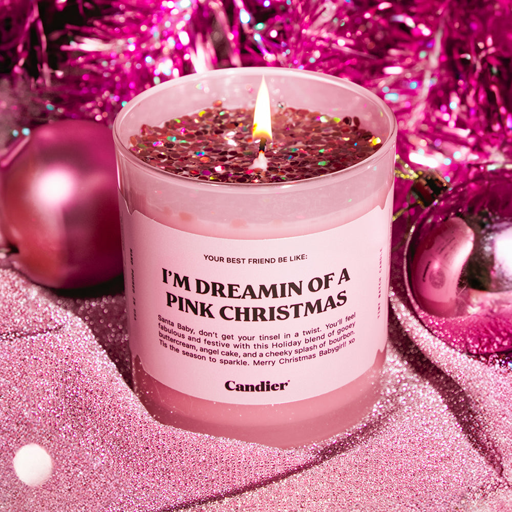 a cute sparkling pink Christmas candle that reads I'm dreaming of a pink Christmas, surrounded by pink Christmas decorations