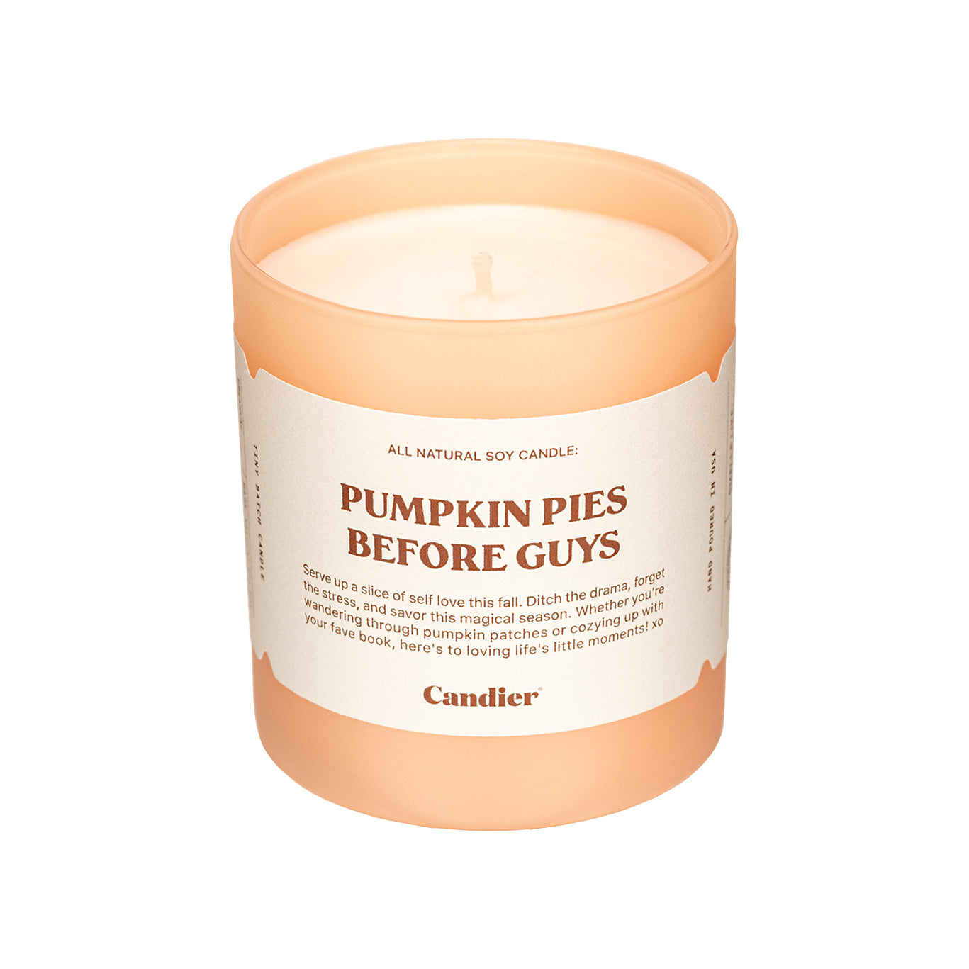 A cute luxury fall scented candle with a label that reads Pumpkin Pies Before Guys