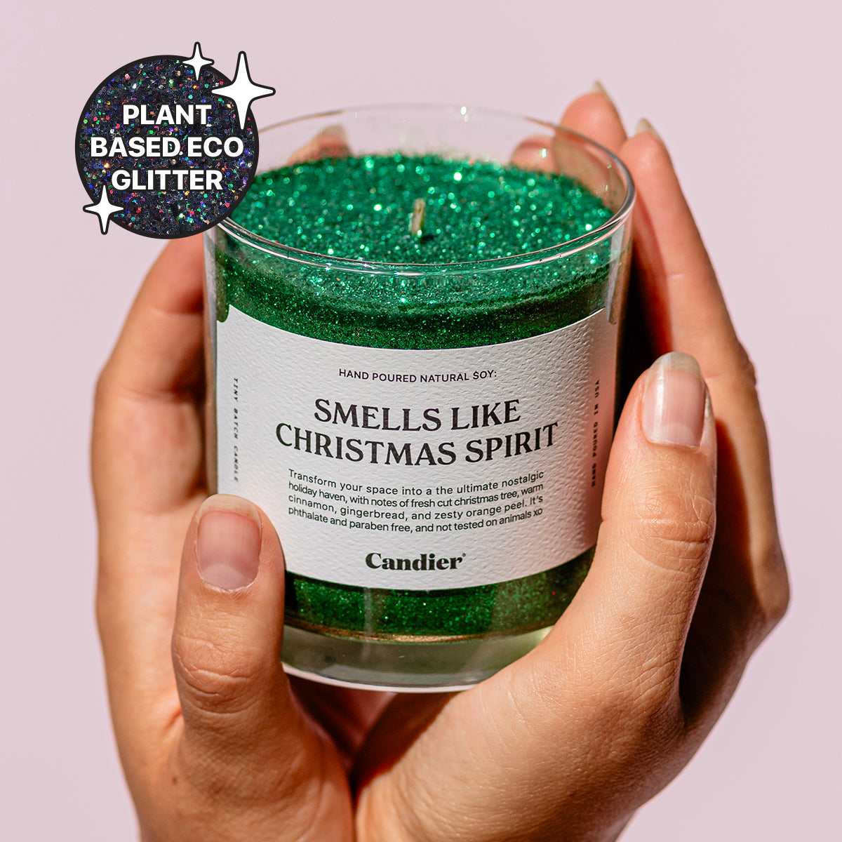 Cute Christmas green glitter scented candle with a label that reads SMELLS LIKE CHRISTMAS SPIRIT by Candier and a badge that says Plant Based Eco Glitter