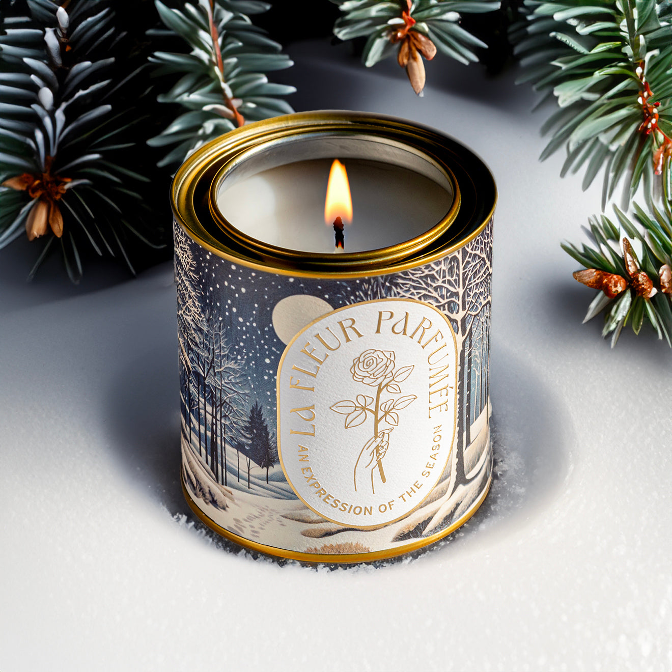 A beautiful holiday candle for the holidays with a snowy wintery scene