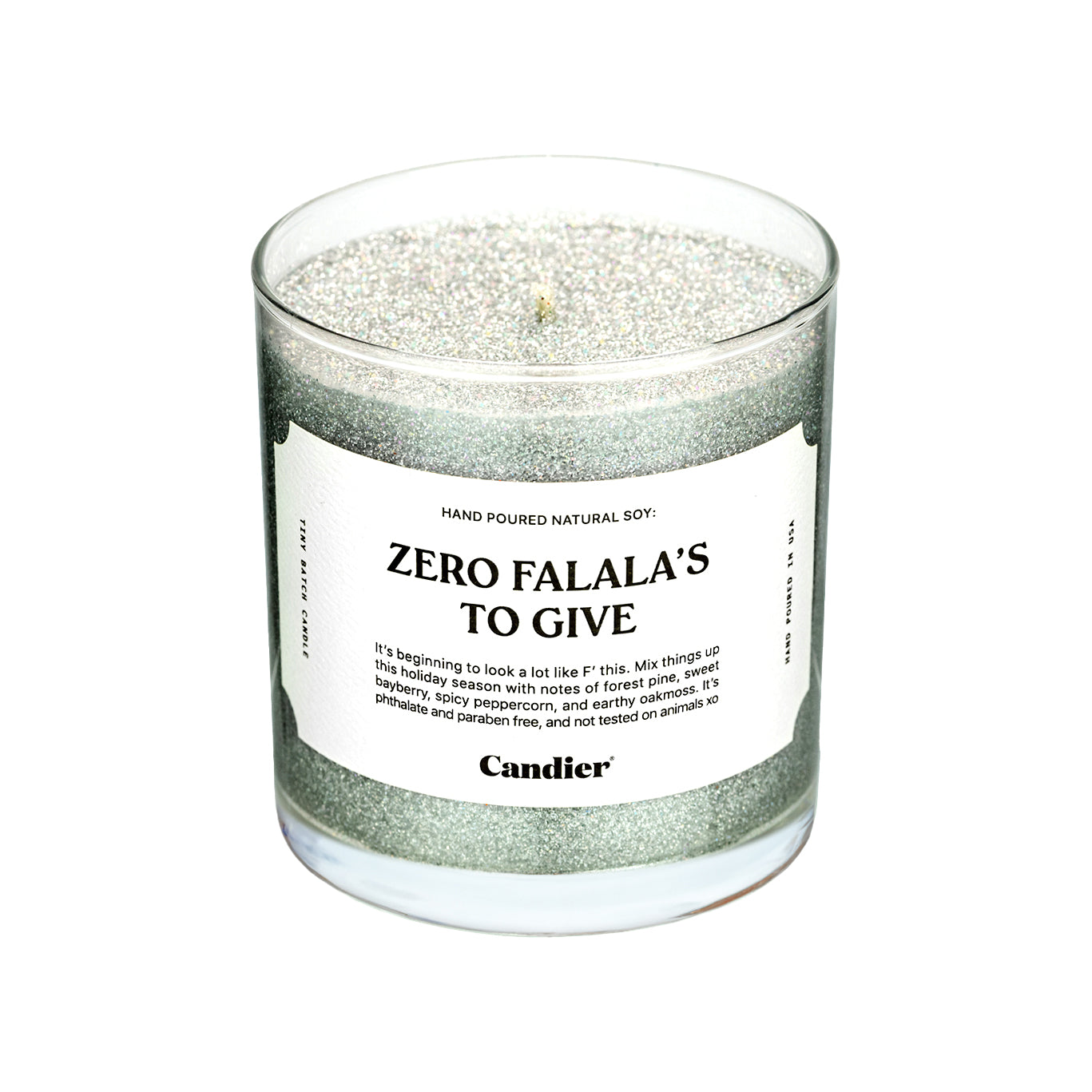 A sparkling Christmas themed candle with a label that read Zero Falala's to Give by Candier, topped with plant based eco glitter