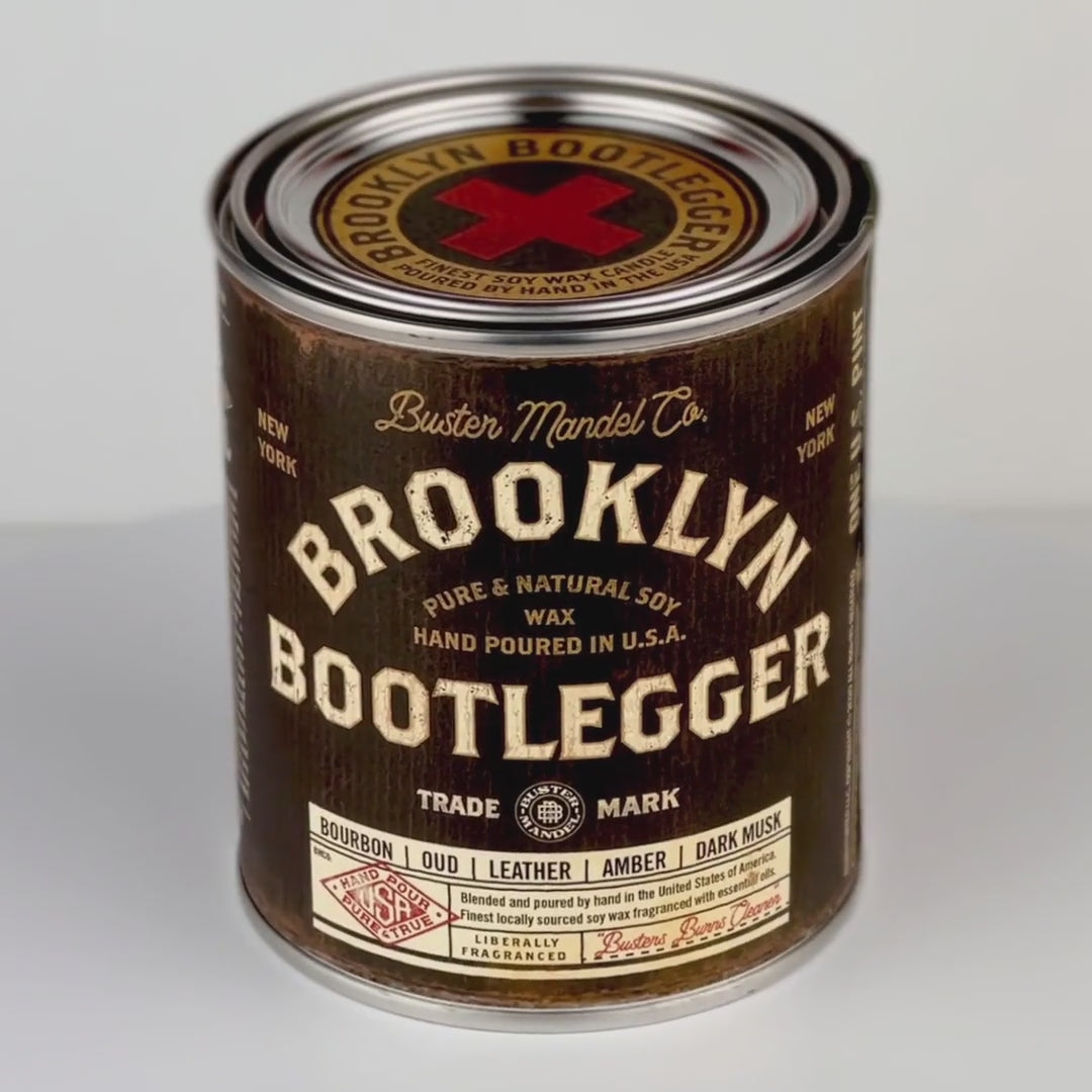 360-degree view of the Brooklyn Bootlegger Candle – a rugged, vintage-inspired candle with smoky oud, bourbon, and musk. Dual wood wicks for a bold burn